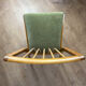Scandinavian chairs with green velvet upholstery.