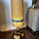 Large vintage ceramic table lamp with rose pattern.