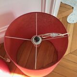Suspension in fabric stretched over celluloid, strawberry red crushed