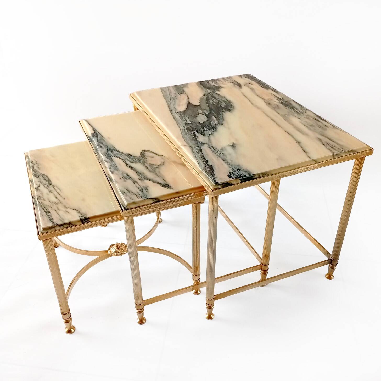 Nested tables in brass and marble.