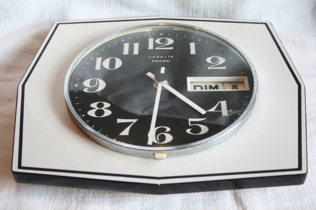 Vintage wall clock clock in formica featured transistor