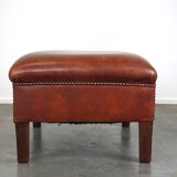 Leather ottoman in classic English style finished with decorative nails