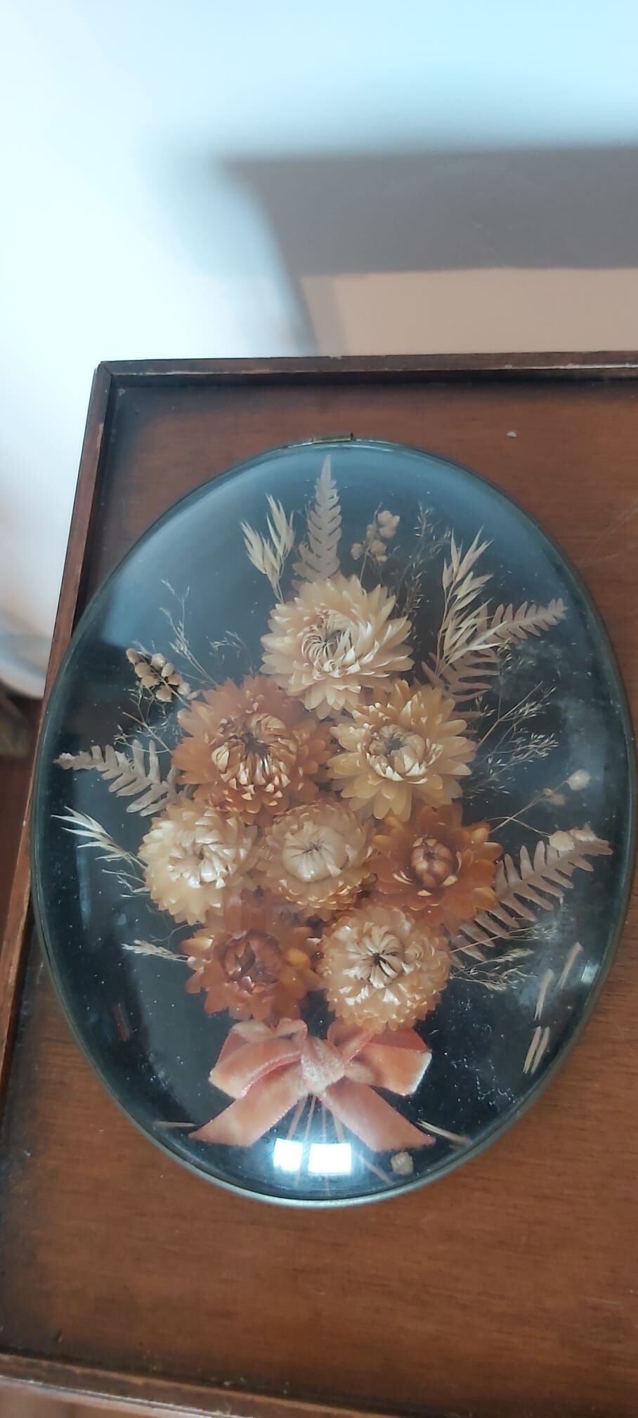 3 frames of dried flowers in curved glass