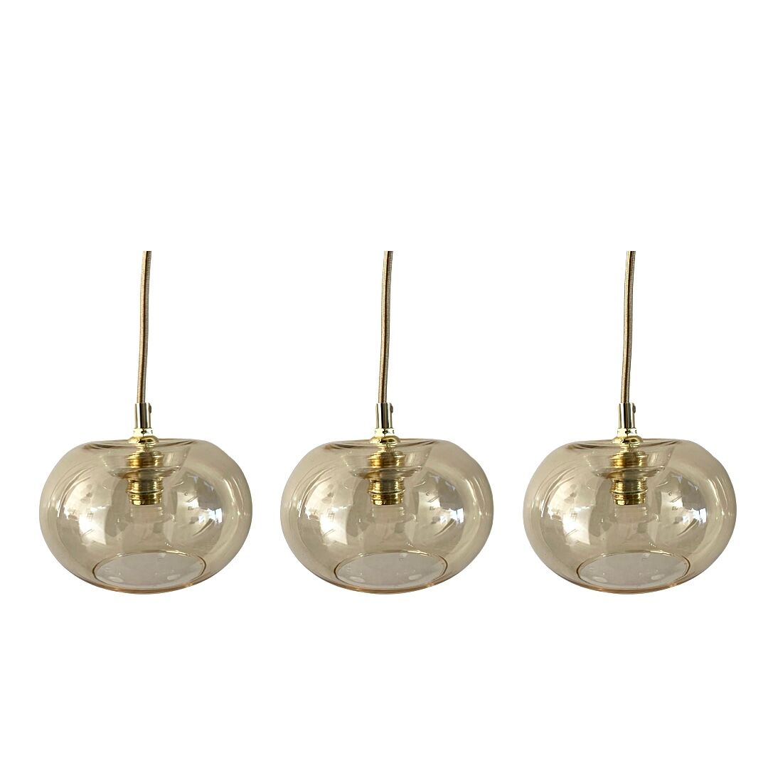 Set of three new electrified golden glass pendant lamps