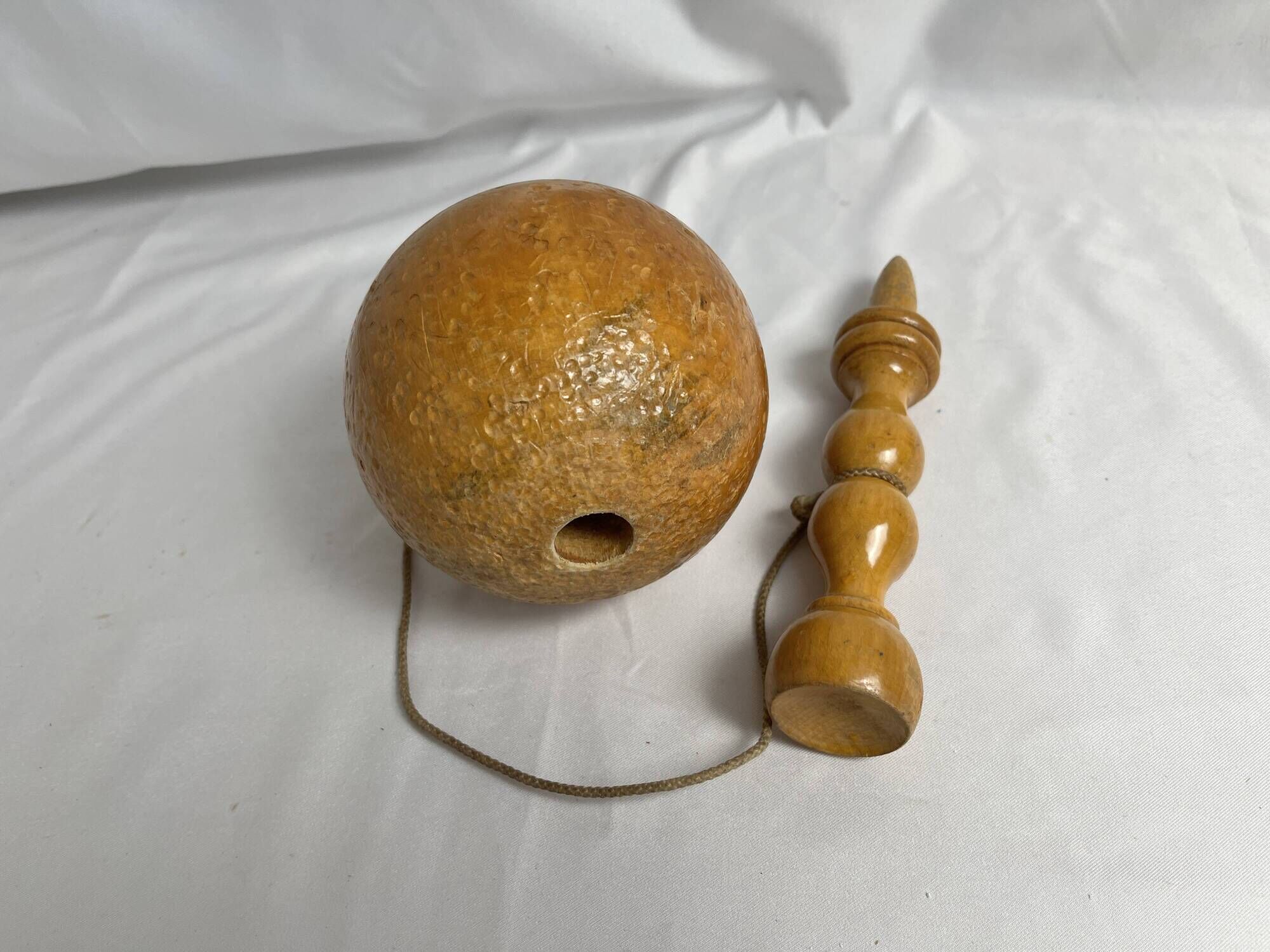 Old bilboquet toy in varnished wood 20th century