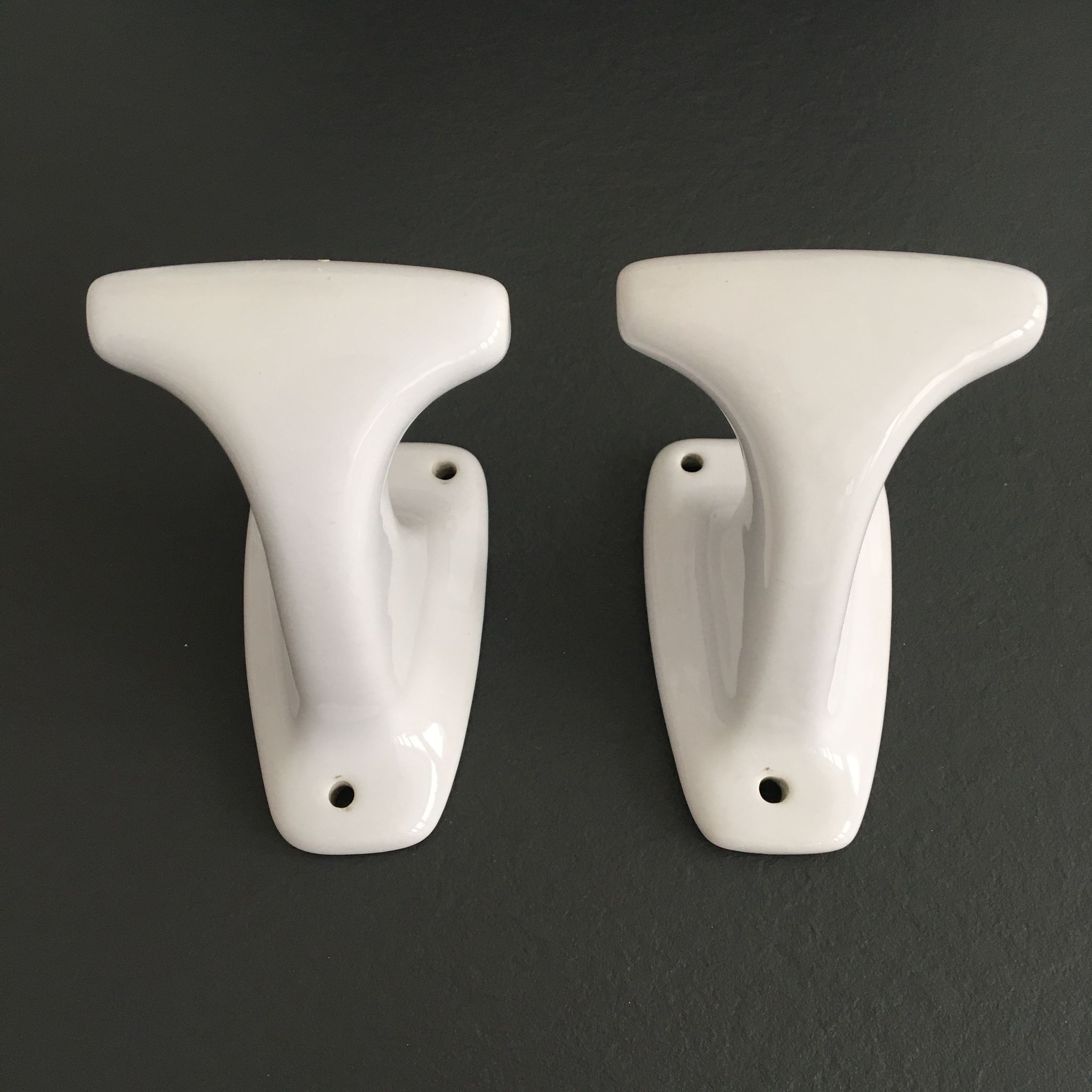 Pair of retro white porcelain hooks