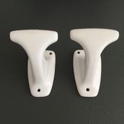 Pair of retro white porcelain hooks