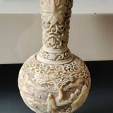 Asian-inspired ball vase. In beige cinnabar lacquer. Scenes of life decor. Arabesque and floral friezes. Height 24 cm