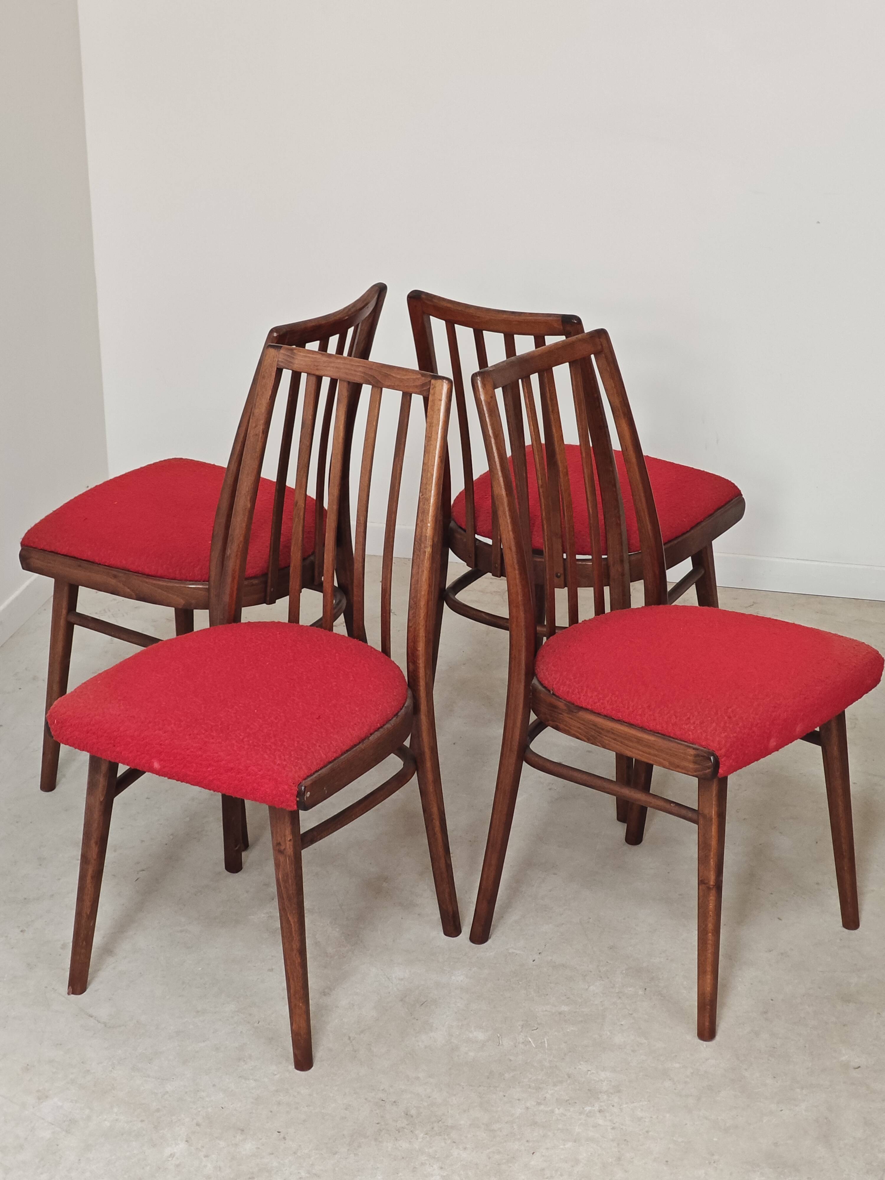 Set of 4 red dining chairs by Antonin Suman for Interier Praha.