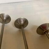 Trio of metal and wood candlesticks