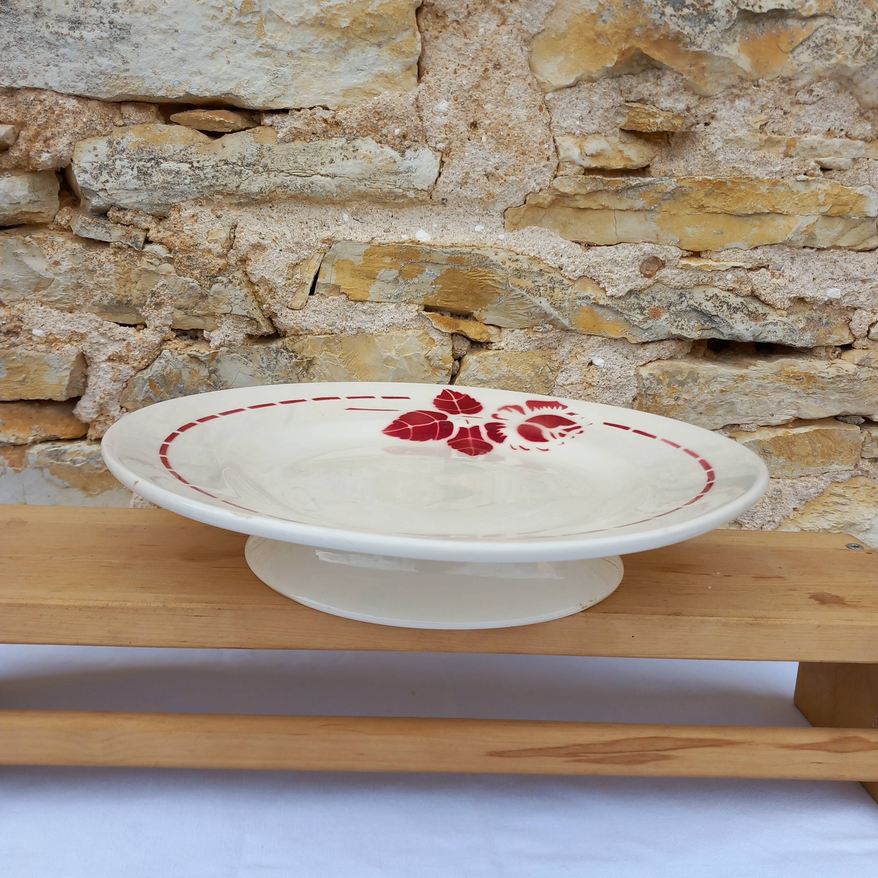 Old presentation plate on red rose foot