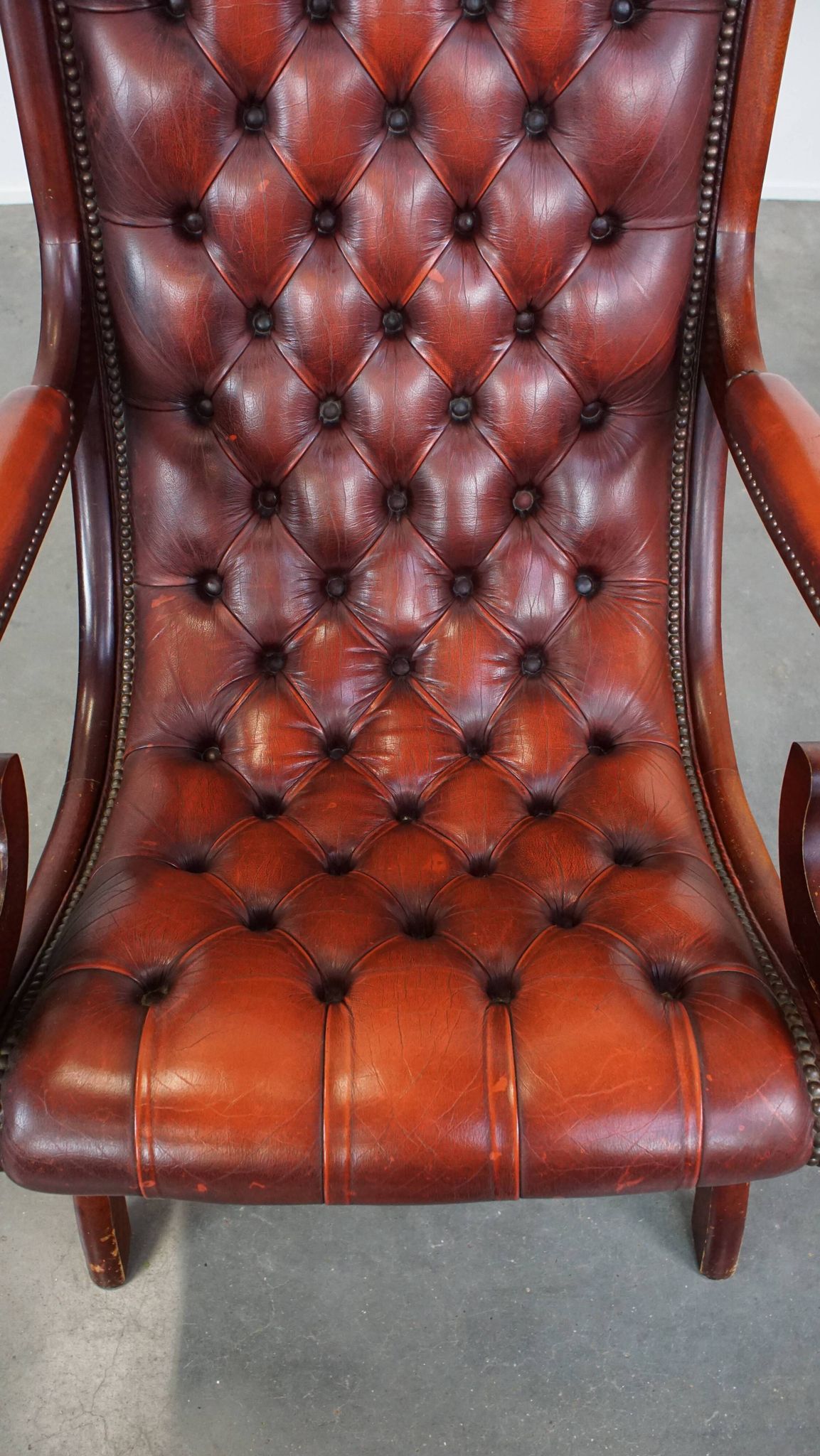 Red cowhide leather English Chesterfield armchair combined with wood