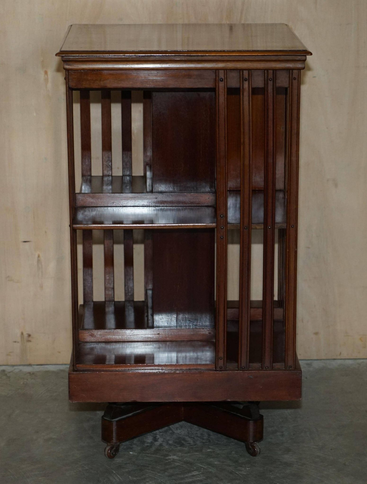 Restored Victorian walnut revolving library.