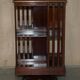Restored Victorian walnut revolving library.