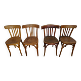 4 mismatched signed bistro chairs