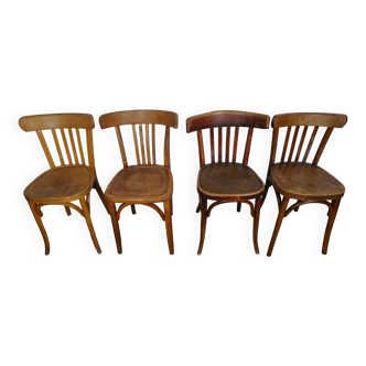 4 mismatched signed bistro chairs