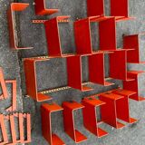 Large modular bookcase shelf in orange thermoformed wood circa 1970