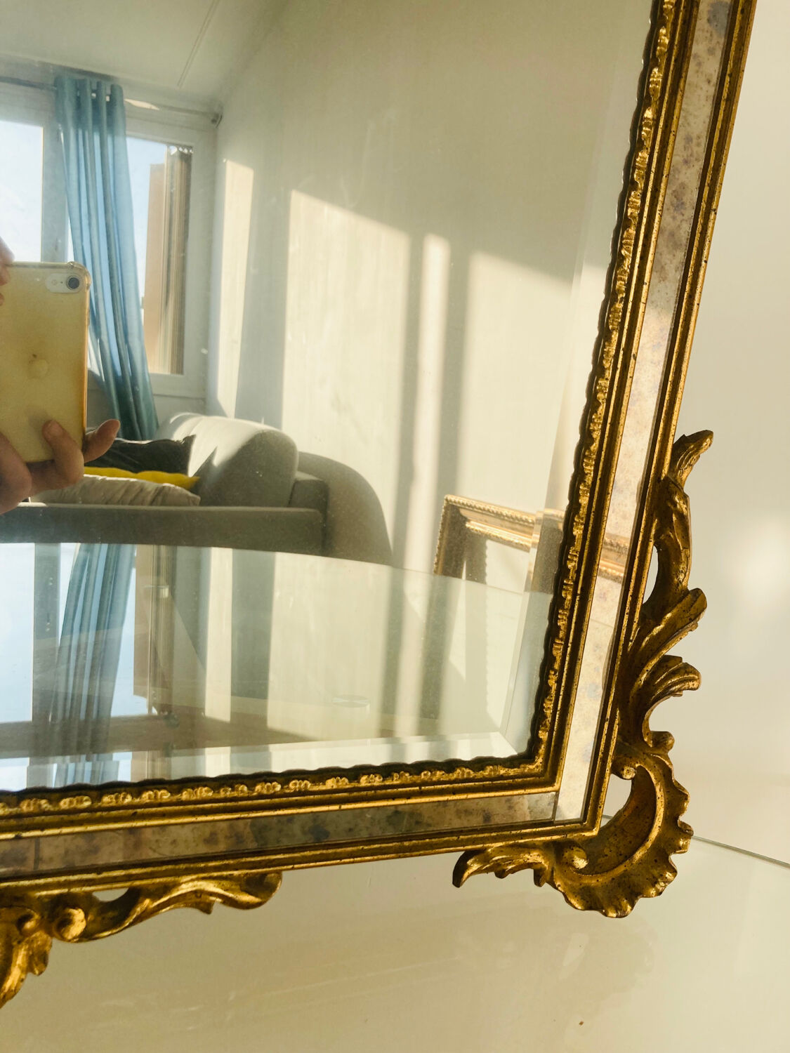 Large golden mirror parecloses