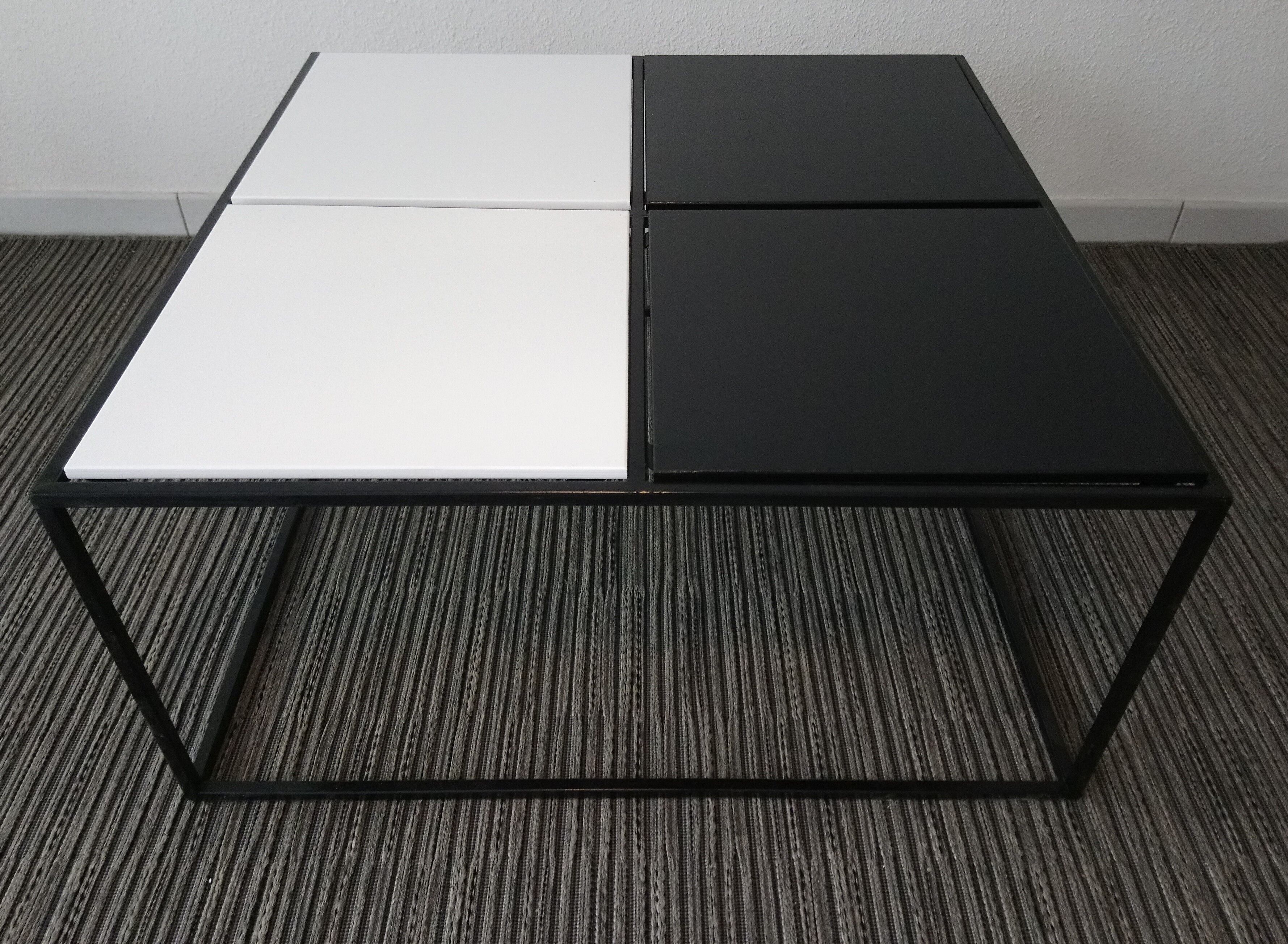 Square coffee table has checkered 80s