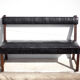 Antique wood bench and black imitation leather