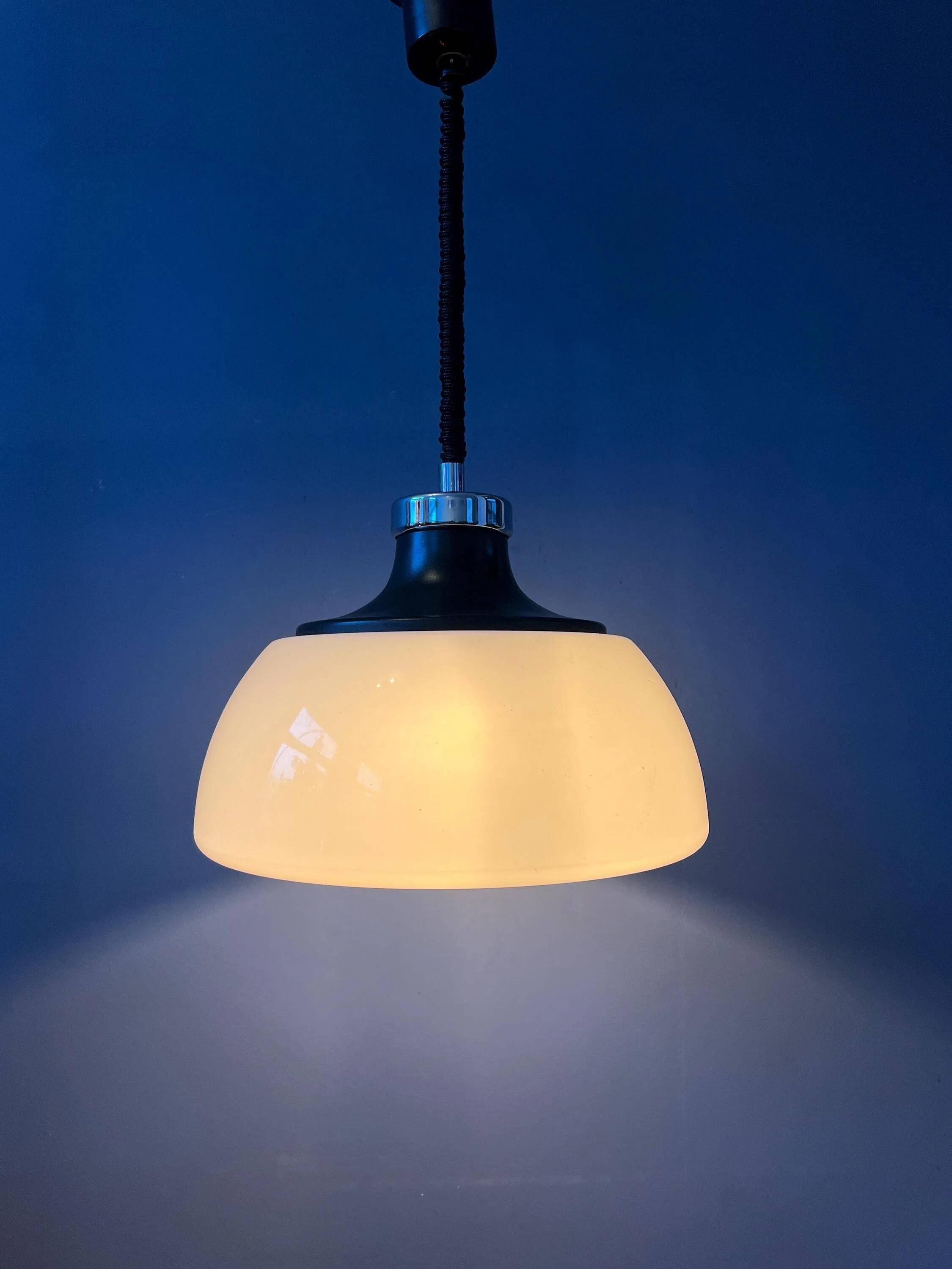 Massive Space Age Mid-Century suspension in plexiglass with white acrylic shade.