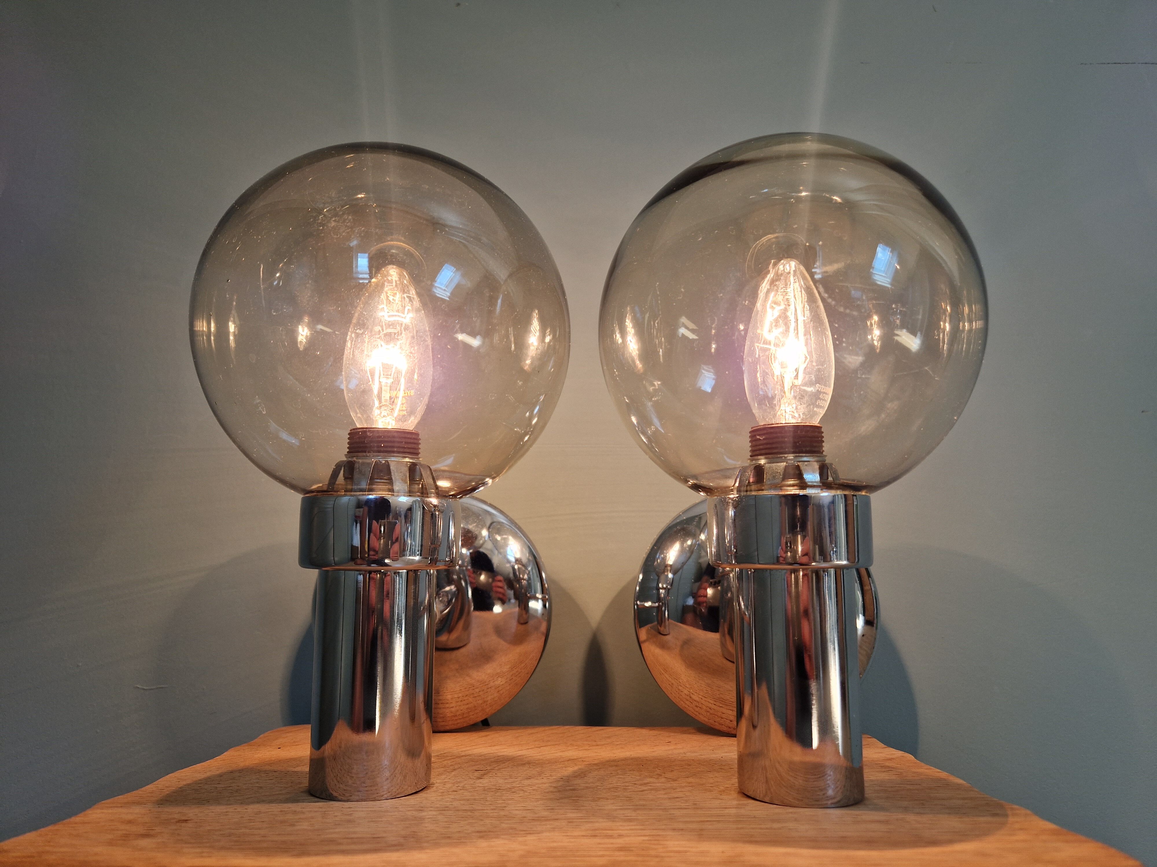 Pair of vintage wall lights in chromed metal and smoked glass, 70s