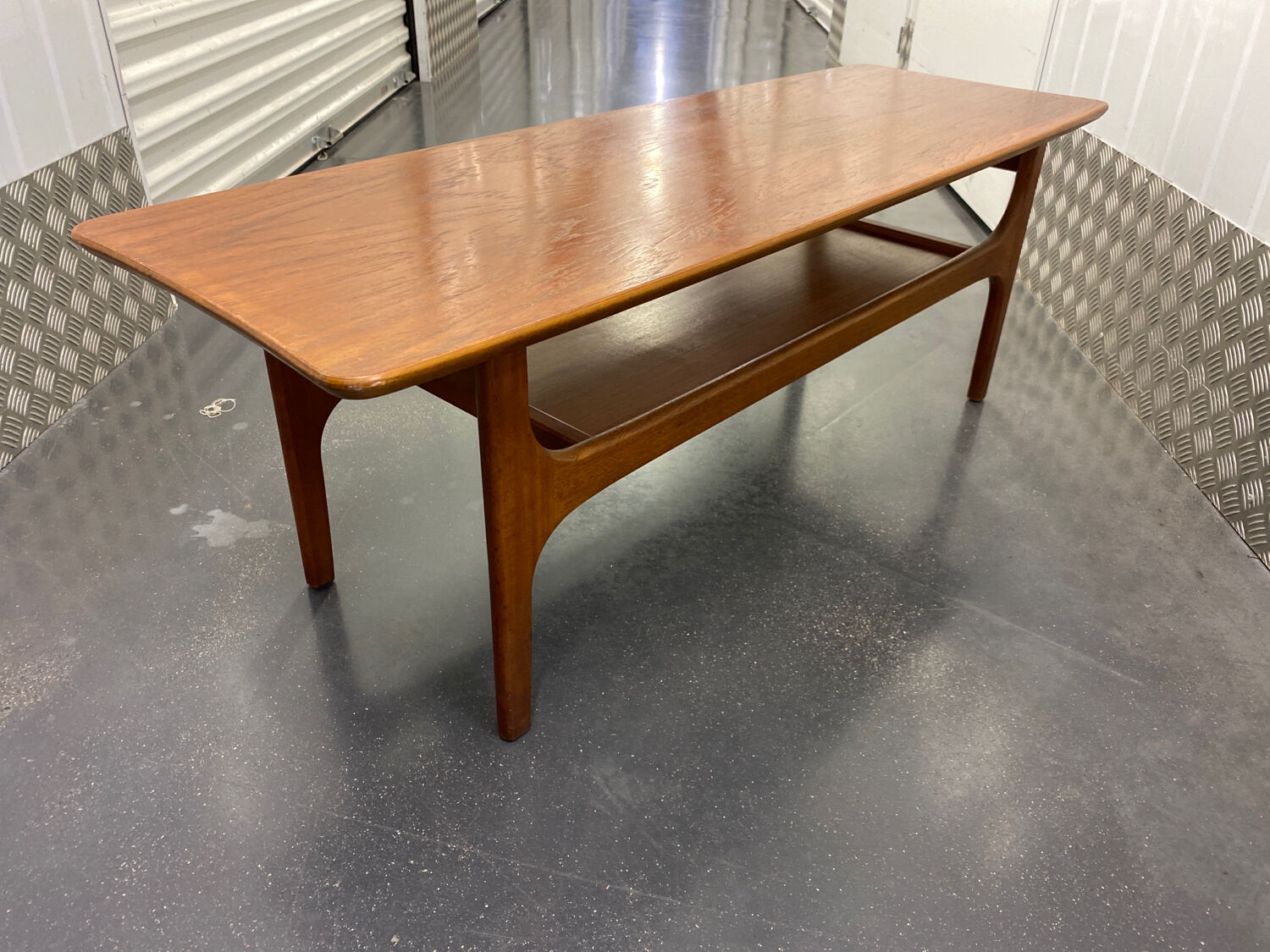 Teak coffee table with under top circa 1960