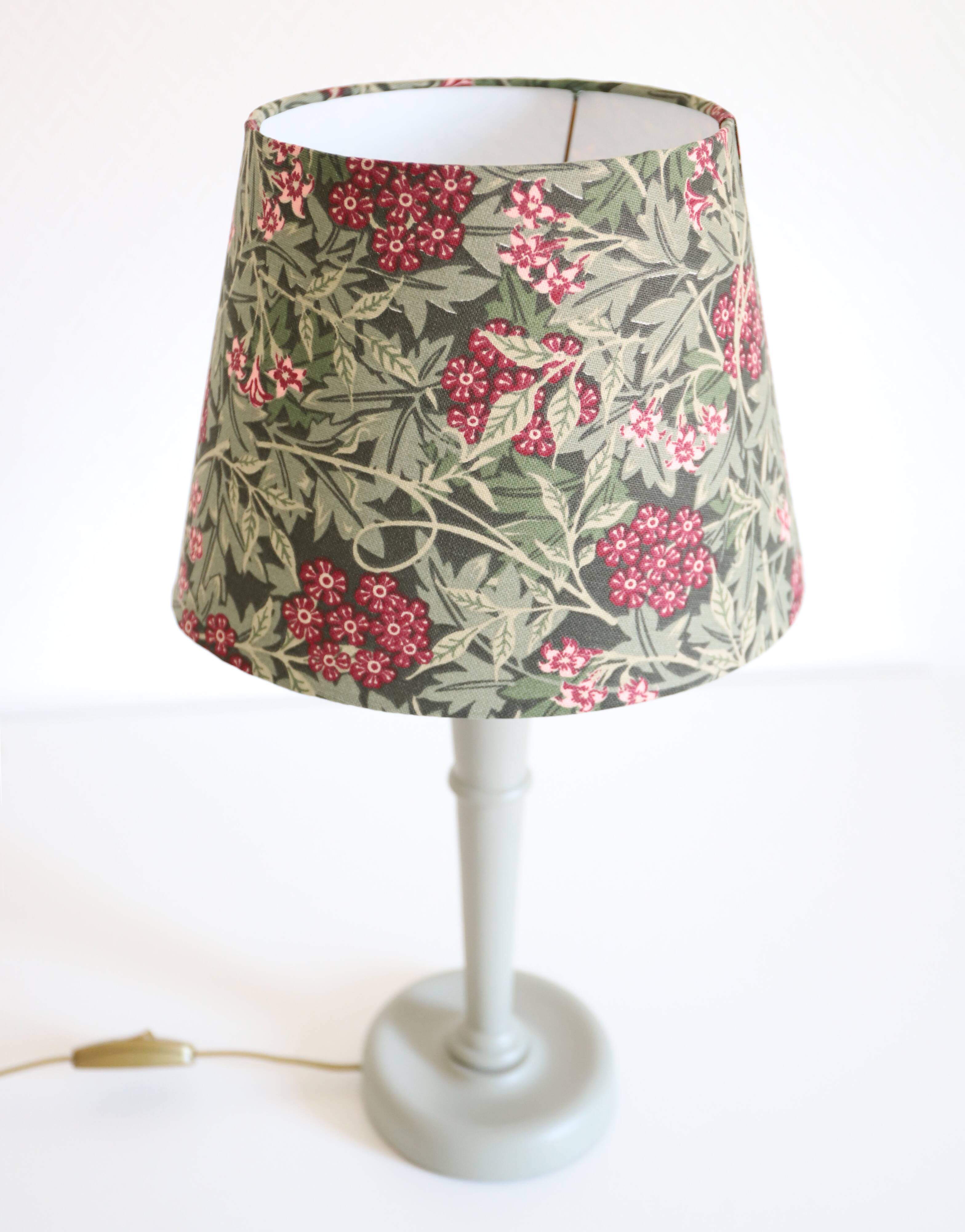 Table lamp, turned wooden base and antique printed lampshade
