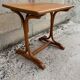 Small side table or bistro serving table with curved wood.