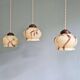 Trio of Art Deco marbled opaline pendant lights, 1920-30
