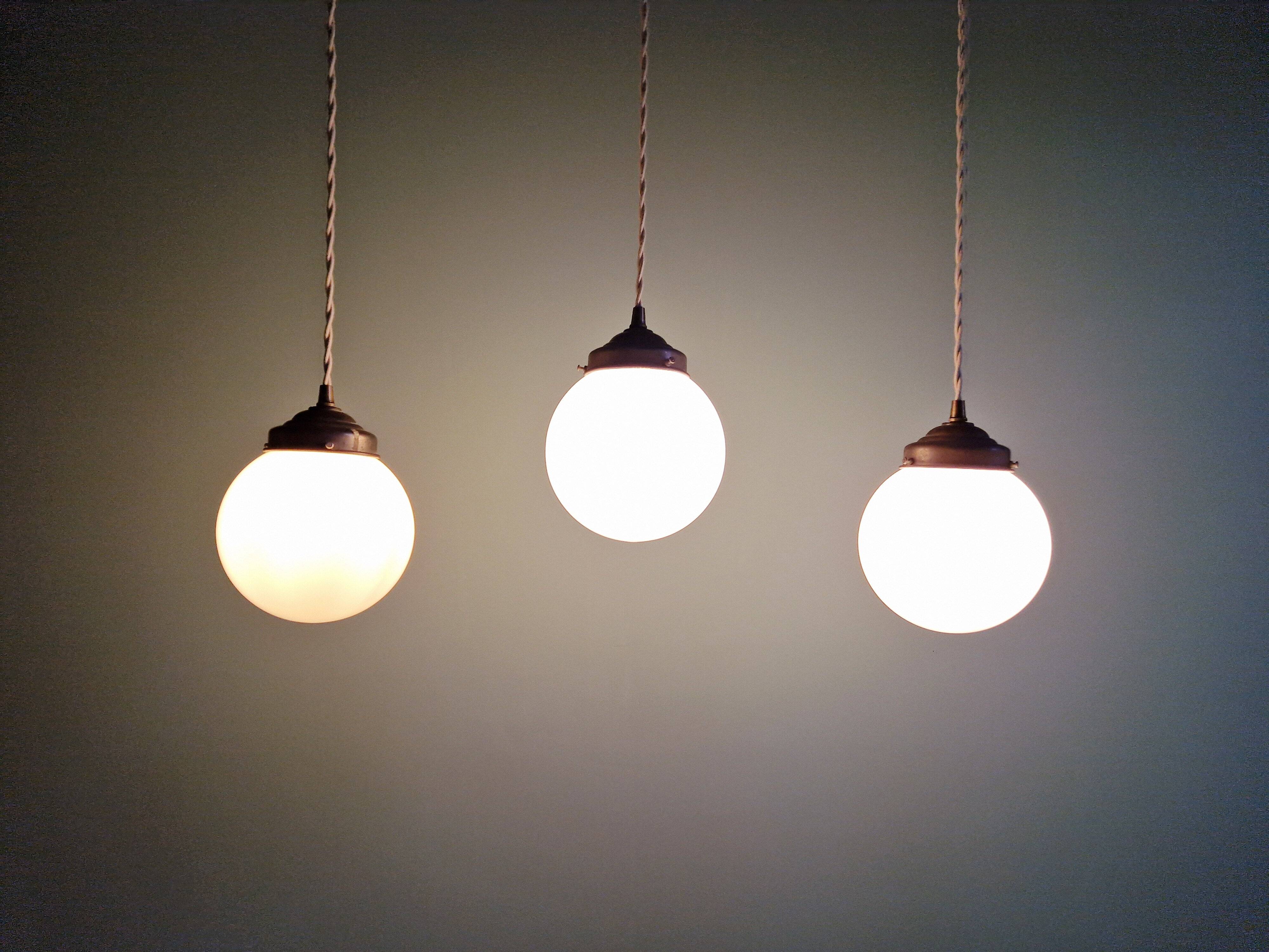 Art Deco trio of suspensions in white opaline, 1930s