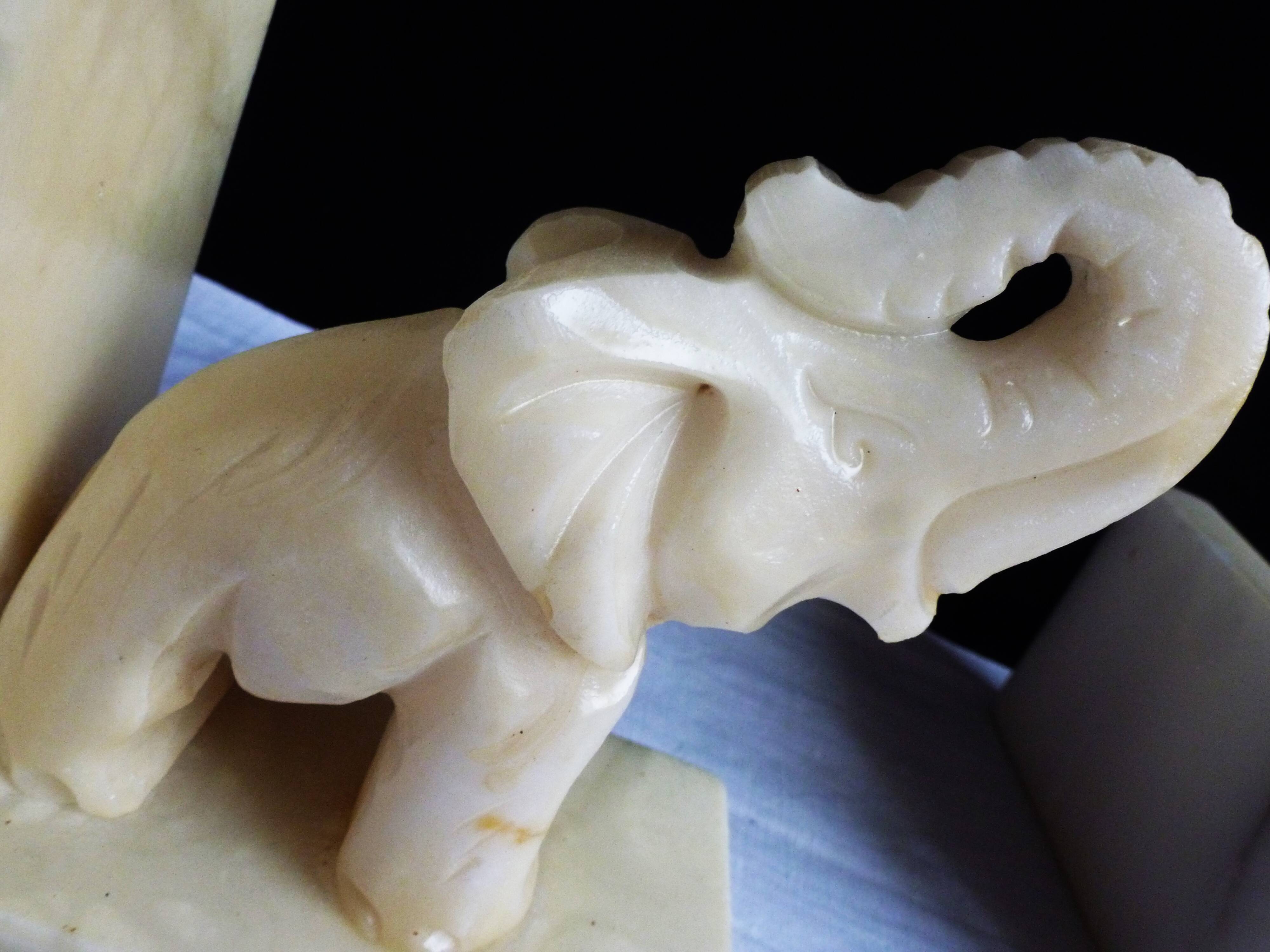 Elephant bookends in alabaster, Pair of elephant bookends.