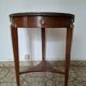 Empire guéridon table in mahogany with a black marble top and gilded bronze.