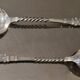12 small Christofle Marly silver-plated spoons in the mascaron pattern.
