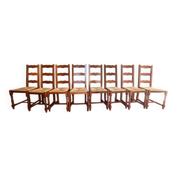 Set of 8 solid varnished oak chairs in excellent condition.