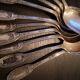 10 small silver metal spoons