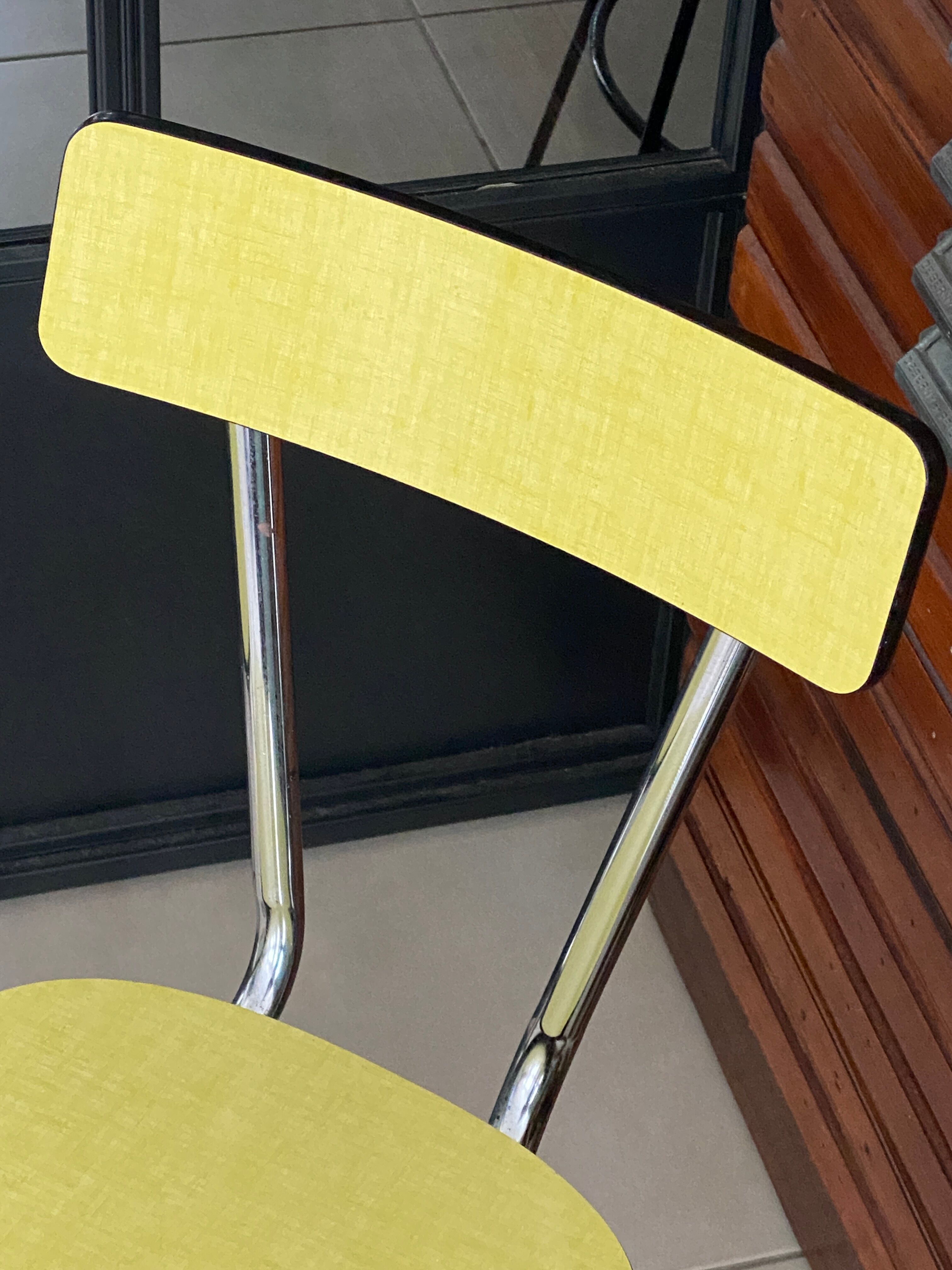Pair of yellow formica chairs
