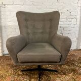 Swivel armchair in velvet fabric and metal