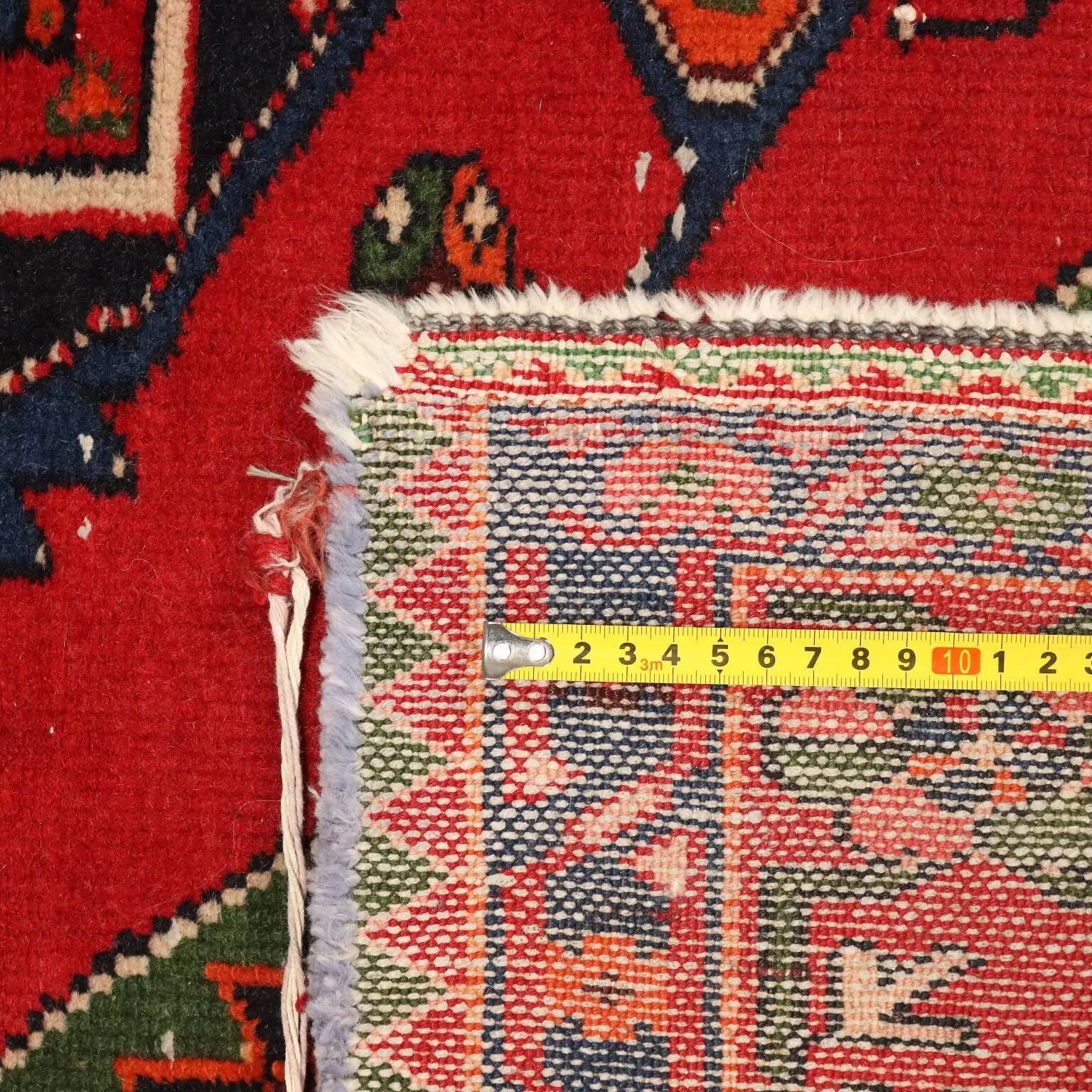 Ancient Asian rug made of cotton and wool, large knot.