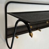Coat rack in black lacquered metal, perforated sheet metal and brass in the style of Mathieu Matégot