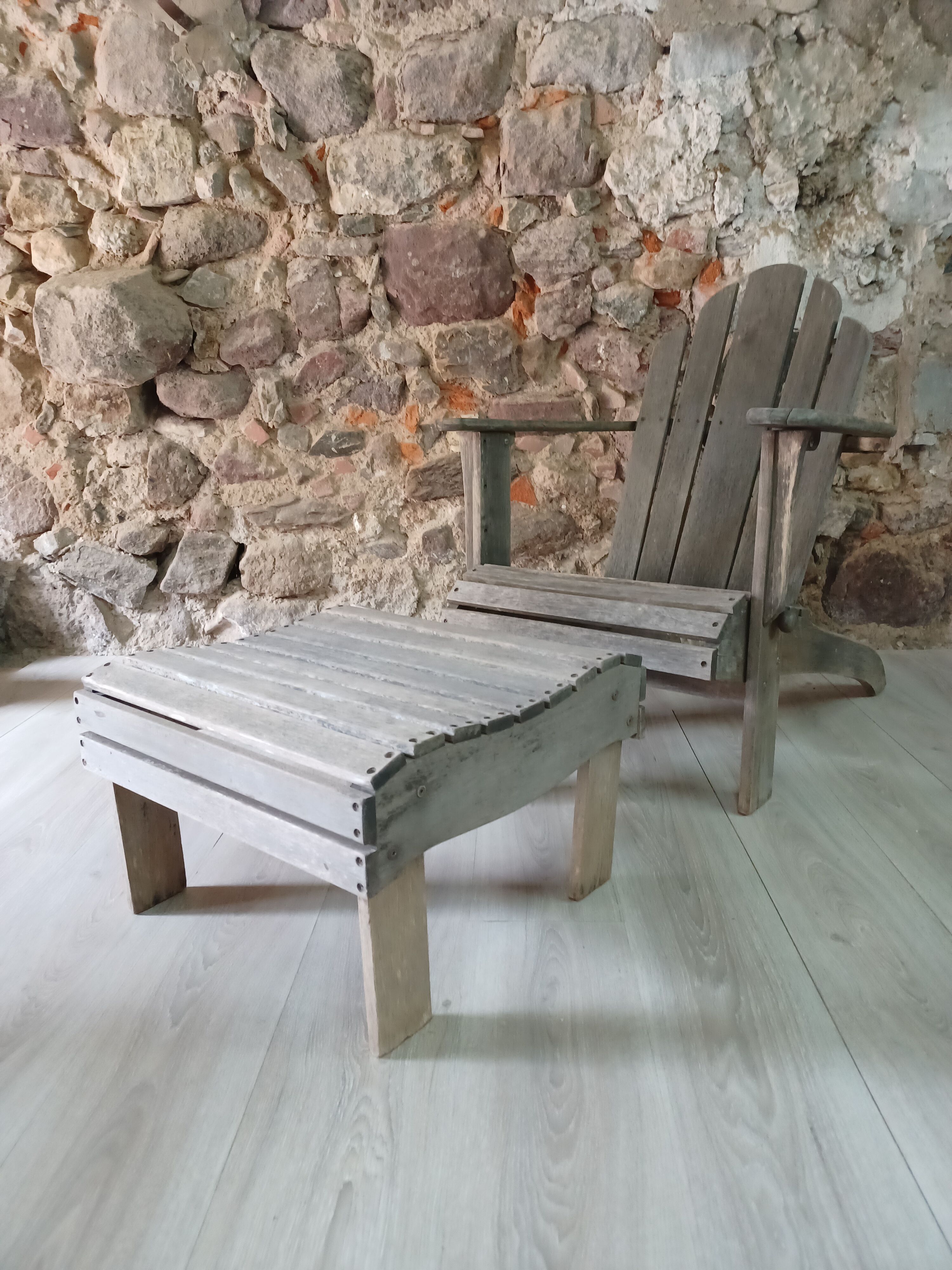 Ancient Adirondack armchair with footrest