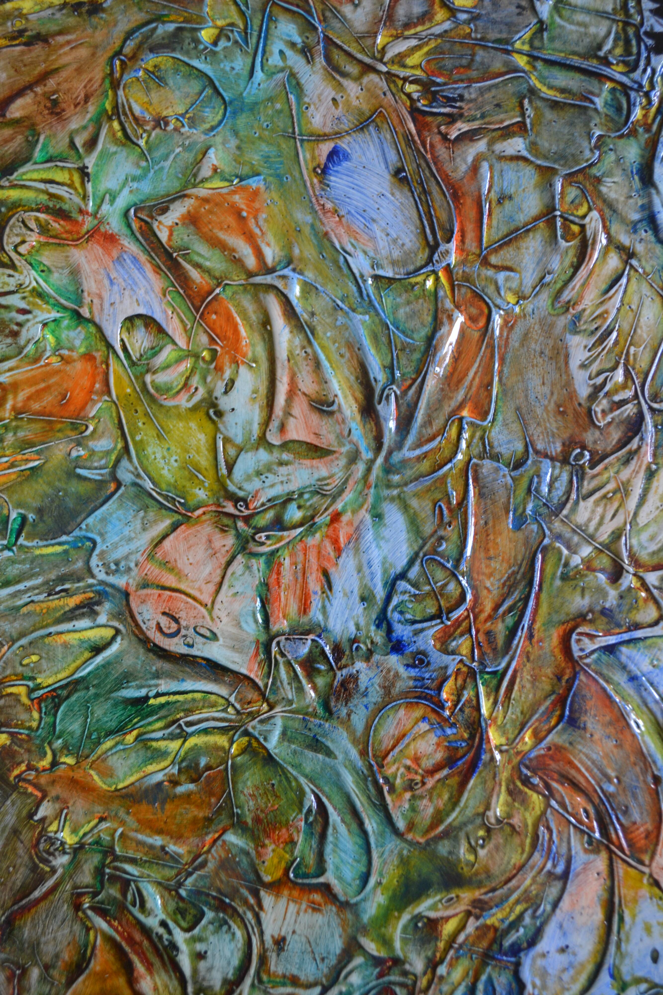 Framed abstract painting under glass