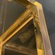 Hollywood Regency style bookcase shelf, gilded brass and black lacquered wood, 1970