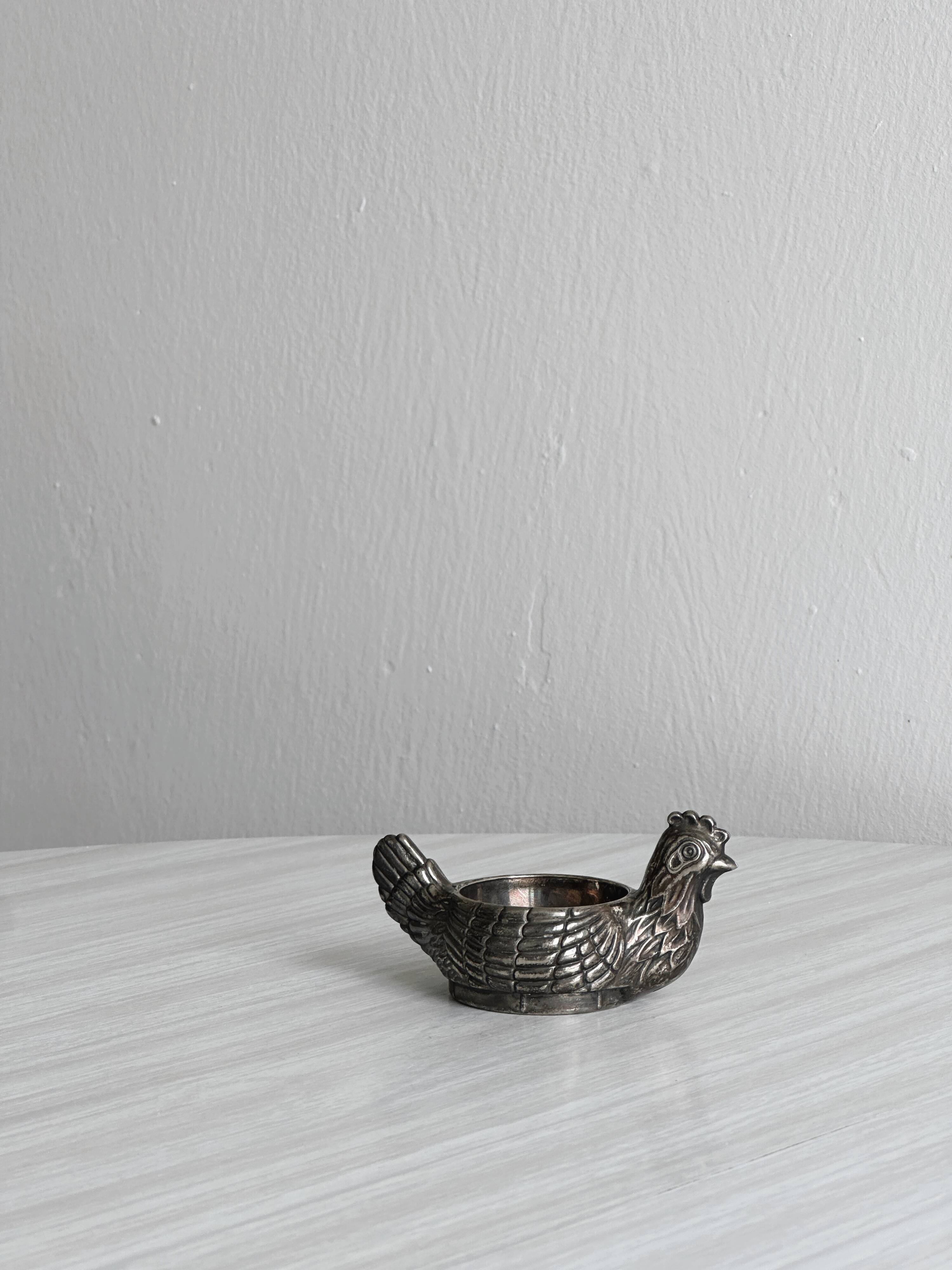 Antique egg cup in the shape of a hen