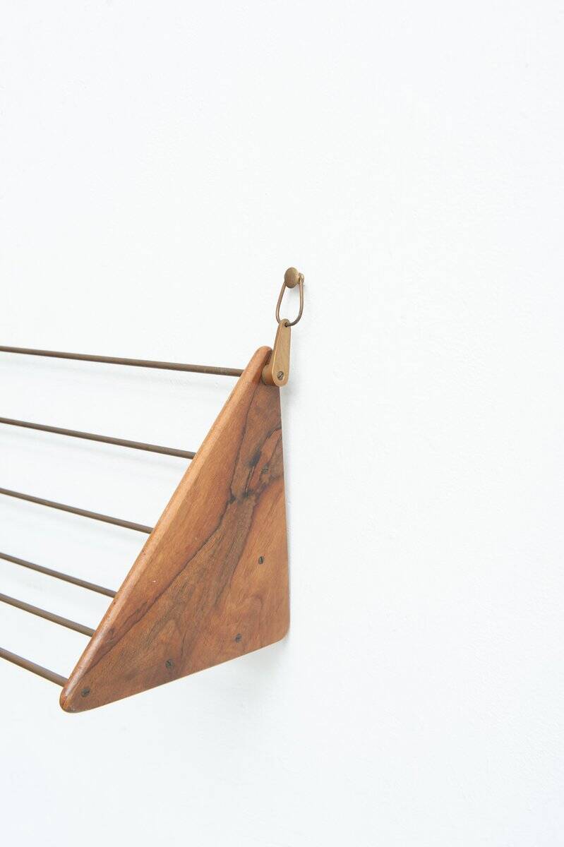 Wall-mounted walnut bookshelf by Carl Auböck, 1950s