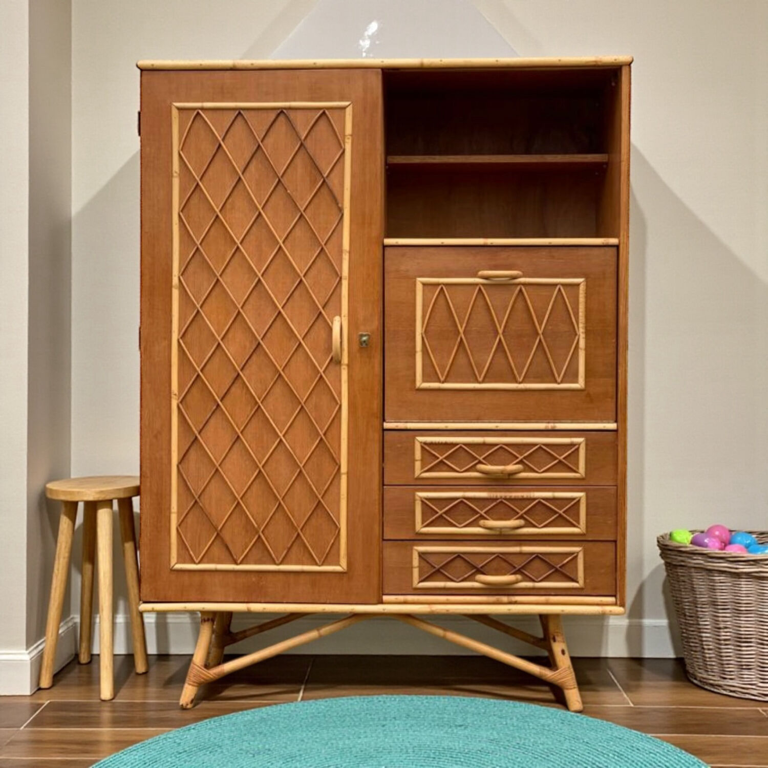 Rattan wardrobe with tapered legs from the 1960s.