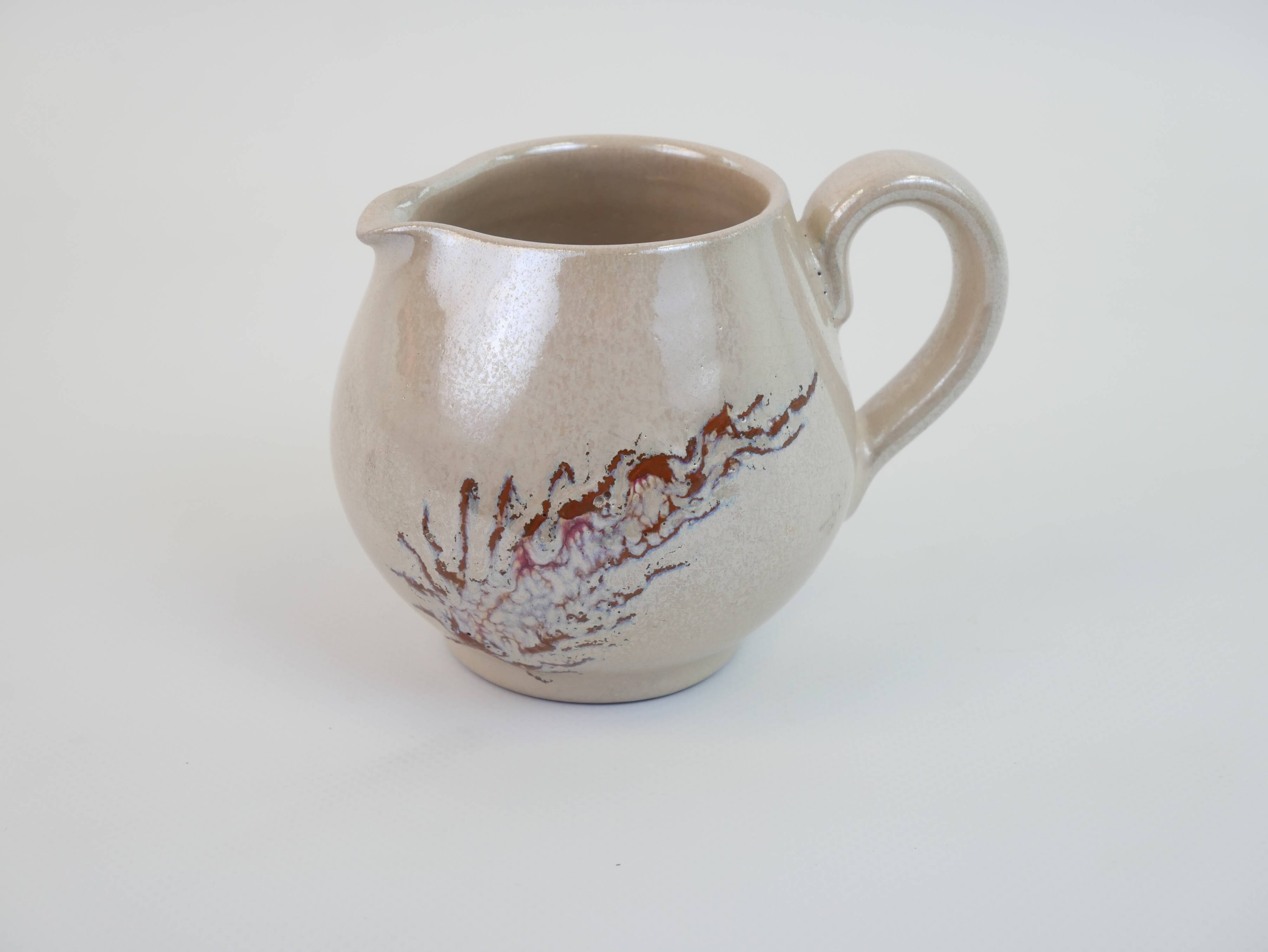 Pair of ceramic milk jugs signed La Roue Vallauris