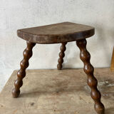 Wooden tripod farm stool