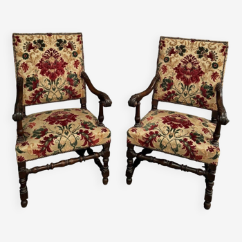 Pair of Louis XIII style armchairs in late 19th century walnut and velvet
