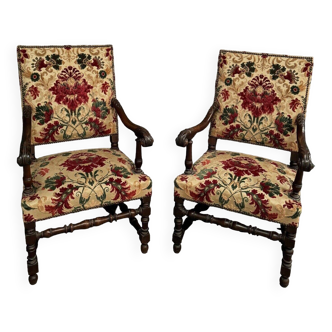 Pair of Louis XIII style armchairs in late 19th century walnut and velvet